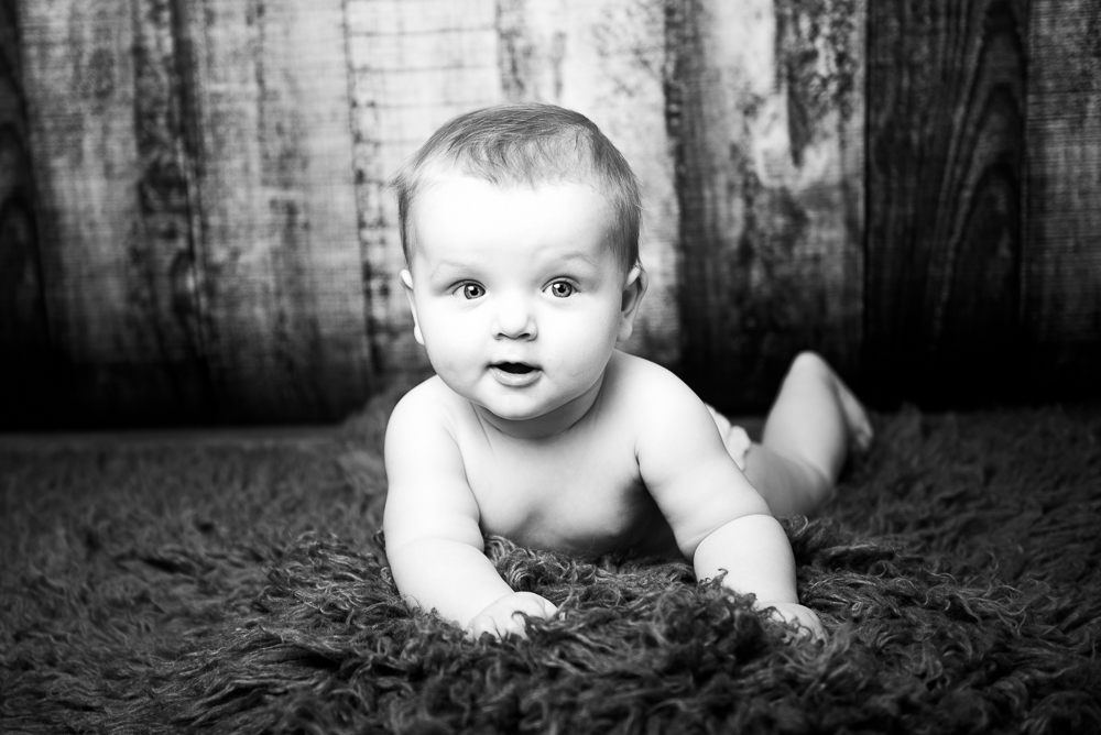 baby on front milestone session black and white
