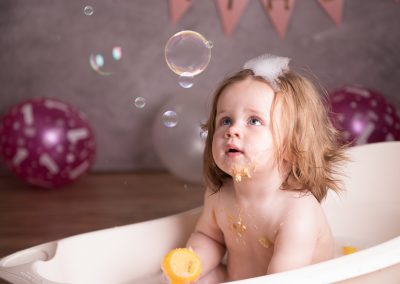 little girl cake smash bubble bath giant bubble